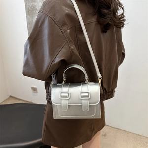 Silver contrast shoulder bag for women with metallic leather and buckle decor