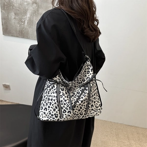 Large leopard print hobo shoulder bag for women with dual zipper and bow detail