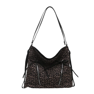 Large leopard print tote bag with double front zippers and black tassel details