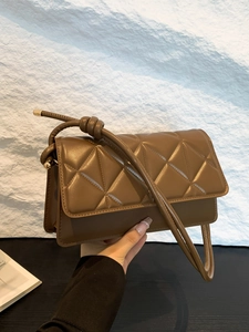 Brown quilted crossbody bag with knotted strap and gold hardware for women