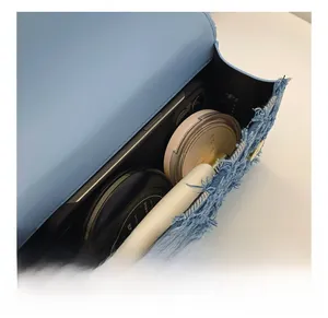 Detailed macro view showing the internal capacity of this denim shoulder bag for daily items