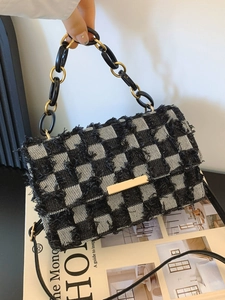 Denim checkerboard crossbody bag with fringe trim, resin chain, and gold buckle closure