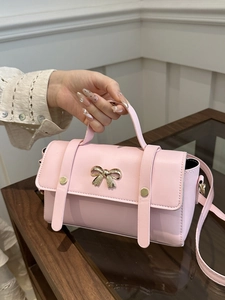 Pink chic faux leather handbag with golden bow metal buckle and adjustable shoulder strap