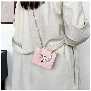 Pink patent leather mini square bag with pearl handle and golden floral clasp detail