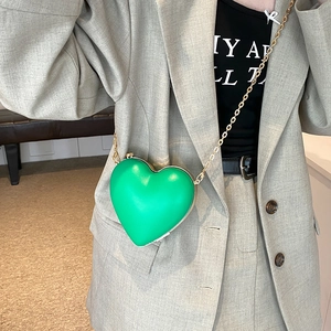 Modern heart-shaped bright green crossbody bag with gold metal chain and trim for women