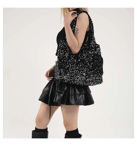 Detail shot of black sequin hobo bag showing high-density reflective finish and wide strap
