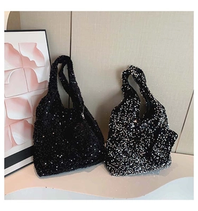 Detail showing high-density sequin texture on black and silver gradient tote bags