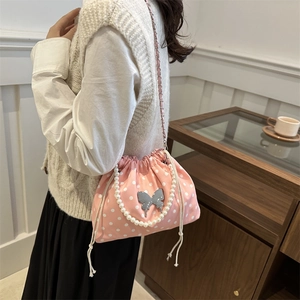 Pink polka dot bucket bag with pearl handle and metal butterfly for women