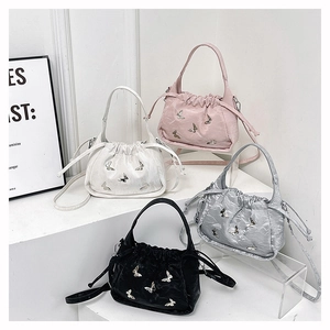 Chic drawstring bucket bags with butterfly appliques in pink, white, silver and black