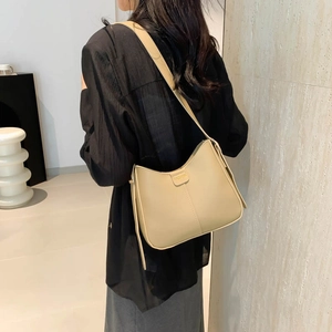 Chic apricot large capacity bucket bag with shoulder strap and fashion label detail