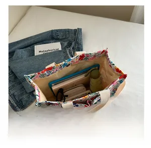 Detail of floral canvas tote bag showing interior capacity with daily essentials