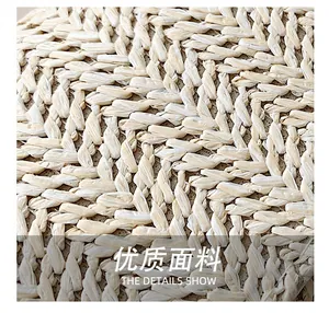Close-up of high-quality natural woven straw texture on minimalist crossbody bag