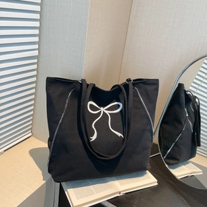 Grand sac cabas en toile noire avec broderie nœud blanc et fermetures éclair latérales