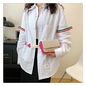 Mini straw waist bag with pink leather trim and adjustable strap shown on model