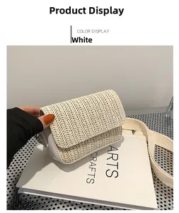 Close-up of white woven crossbody bag showing rectangular flap and matching wide strap