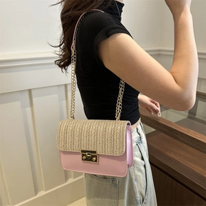 Pink straw patchwork crossbody bag with gold chain strap and metallic closure for summer