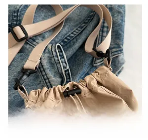 Close-up of nylon drawstring closure with black adjuster buckle and durable fabric strap