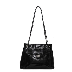 Classic black glossy leather shoulder bag with silver chain strap and metal swivel lock