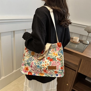 Minimalist large floral canvas tote bag with brown leather handles for daily commuting