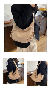 Detail view of beige corduroy crescent bag showing fabric texture and adjustable strap