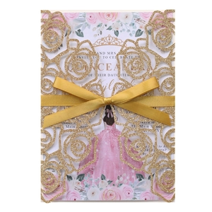 Detailed view of laser-cut glitter rose invitation with a golden satin ribbon bow