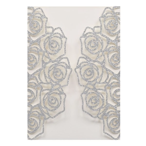 Close-up of laser cut hollow rose pattern on silver glitter paper wedding invitation card