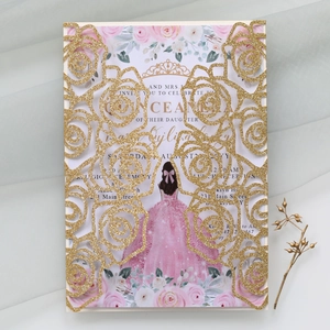 Macro detail of laser-cut gold glitter rose invitation with floral card insert