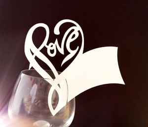 Laser-cut white heart place card with love hollow detail for wedding wine glass decor