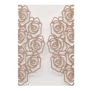 Detail of laser-cut rose gold glitter flower ornaments for wedding invitations