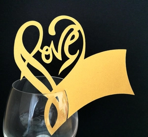 Golden heart-shaped laser-cut Love place card for elegant glass decoration