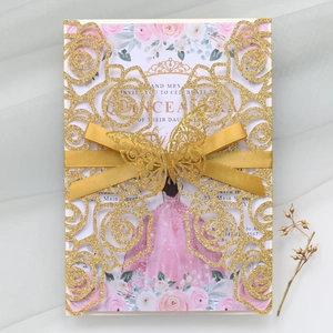 Glittery gold laser-cut invitation featuring 3D butterfly, ribbon, and floral inner card