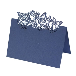 Dark blue laser cut place card featuring elegant butterfly hollow design for weddings