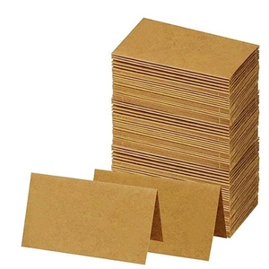 Brown kraft paper table name cards with elegant butterfly cutout for wedding decoration