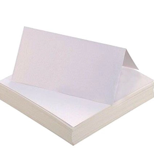 Pearlescent white laser-cut butterfly place cards for wedding table seat settings