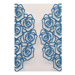 Detail view of blue glitter laser cut wedding invitation with intricate rose flower patterns