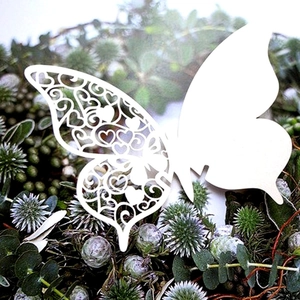 Elegant 3D white butterfly place card with laser-cut heart hollow pattern and wings