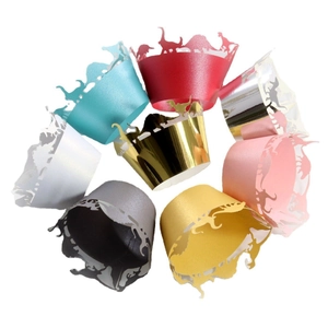Laser cut dinosaur themed cupcake wrappers in various colors with metallic pearl finish