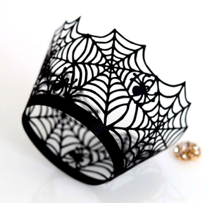 Laser-cut black spider web cupcake wrappers featuring intricate spider lace patterns