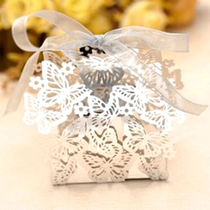 Elegant laser-cut butterfly wedding favor box in white pearl paper with silver ribbon