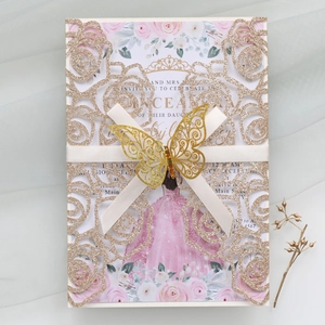 Detailed laser cut rose gold glitter wedding card with golden butterfly and ribbon