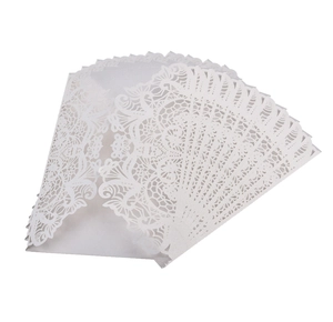 Detailed laser cut lace pattern on white pearlescent paper wedding invitation envelopes