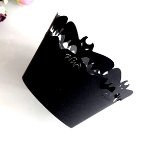 Laser-cut black cupcake wrapper featuring realistic bat silhouette for Halloween decor