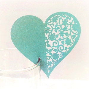 Detail of laser-cut heart glass card in blue pearlescent paper for table decoration