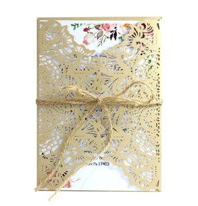 Gold laser-cut lace wedding invitation card with twine and floral inner page