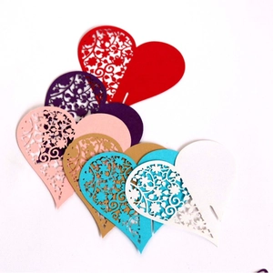 Laser cut heart shaped place cards in various colors for wedding table decorations