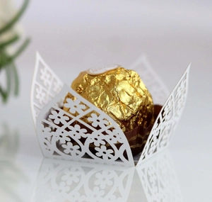 Elegant white laser-cut floral chocolate paper wrappers for luxury wedding party decoration