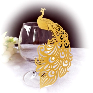 Elegant gold laser-cut peacock place cards for wedding glasses and banquet decor