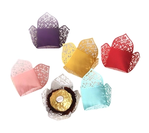 Laser-cut floral chocolate liners in multiple colors for wedding party decorations