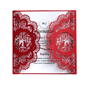 Laser cut red wedding invitation featuring intricate lace floral and love birds pattern