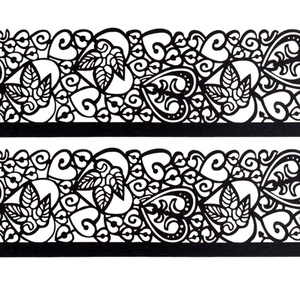 Laser-cut leaf pattern paper candle covers in black with elegant heart lace decorative design
